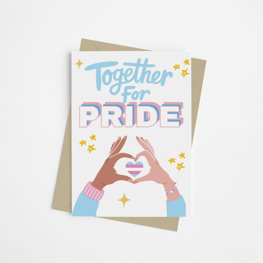 A Trans Pride celebration card with bold text in trans flag colors reading “Together for Pride.” Features a heart in trans flag colors formed by two hands in a heart shape. Designed to celebrate Transgender Pride with allies, family and friends. 
