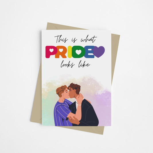 A vibrant colourful card, with a queer couple on the front, celebrating pride and kissing. Designed to celebrate LGBTQ+ pride. 